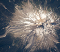 Aerial view of gray volcanic deposits ridges along Mount Hood.
